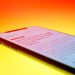 black android smartphone on orange surface