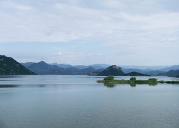 a large body of water surrounded by mountains