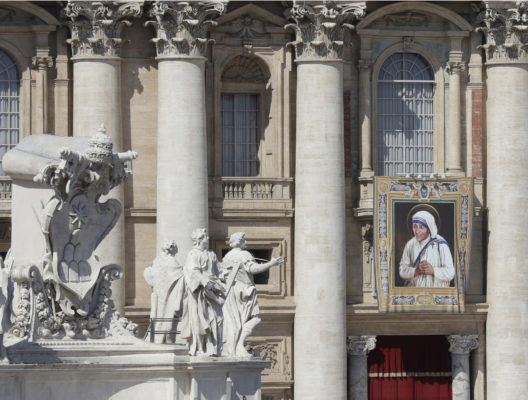 A tapestry depicting Mother Teresa hangs from the balcony of St. Peter's Basilica during her Canonization Mass at the Vatican, Sunday, Sept. 4, 2016. Francis has declared Mother Teresa a saint, honoring the tiny nun who cared for the world's most destitute as an icon for a Catholic Church that goes to the peripheries to find poor, wounded souls. (AP Photo/Alessandra Tarantino)