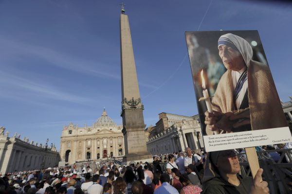 A nun holds a photo of Mother Teresa before the start of the canonization ceremony in St. Peter's Square at the Vatican, Sunday, Sept. 4, 2016. Thousands of pilgrims thronged to St. Peter's Square on Sunday for the canonization of Mother Teresa, the tiny nun who cared for the world's most unwanted and became the icon of a Catholic Church that goes to the peripheries to tend to lost, wounded souls. (AP Photo/Alessandra Tarantino)