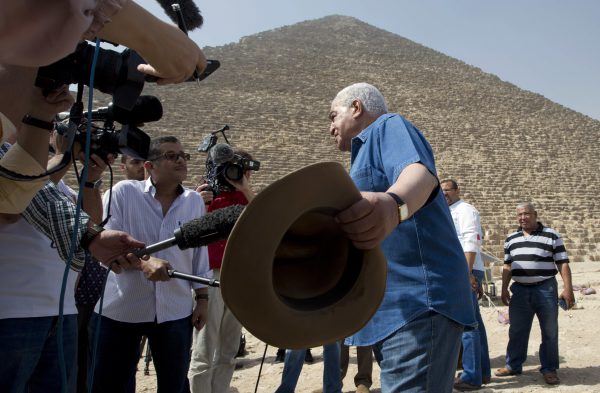 Egyptian archaeologist Zahi Hawass, Egypt's former head of antiquities, speaks in front of the Great Pyramid, built by Cheops, known locally as Khufu in Giza, Egypt, Thursday, June 2, 2016. A scientific team scanning the Great Pyramid aimed at discovering the famed pharaonic monument's secrets including possible hidden burial chambers. (AP Photo/Amr Nabil)