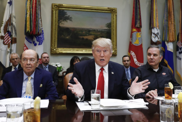 President Donald Trump, flanked by Commerce Secretary-designate Wilbur Ross, left, and Harley Davidson President and CEO Matt Levatich, talks to media before a lunch meeting with Harley Davidson executives and union representatives in the Roosevelt Room of the White House in Washington, Thursday, Feb. 2, 2017. (AP Photo/Carolyn Kaster)